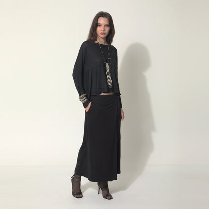 Sarah - Saia-calça de malha com ajuste de fivela de metal na cor preta